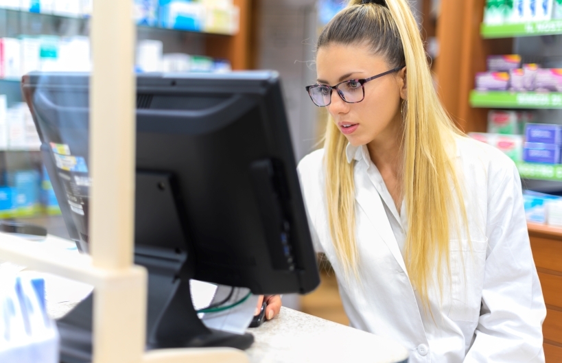 Pharmacist at computer